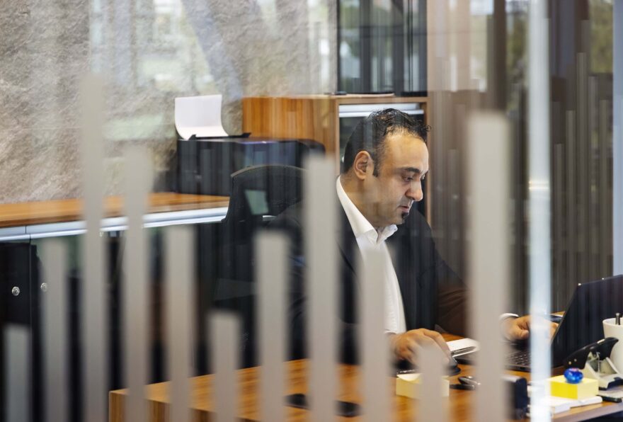Mustafa Alkan from Werner Sobek Istanbul sitting at his desk in the office